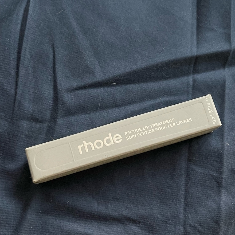 RHODE Peptide Lip Treatment in Gray Box